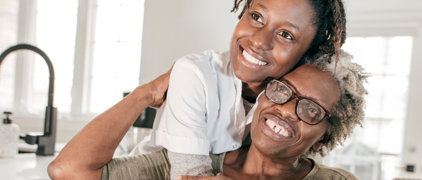 A Jaama caregiver supporting a client during a home visit