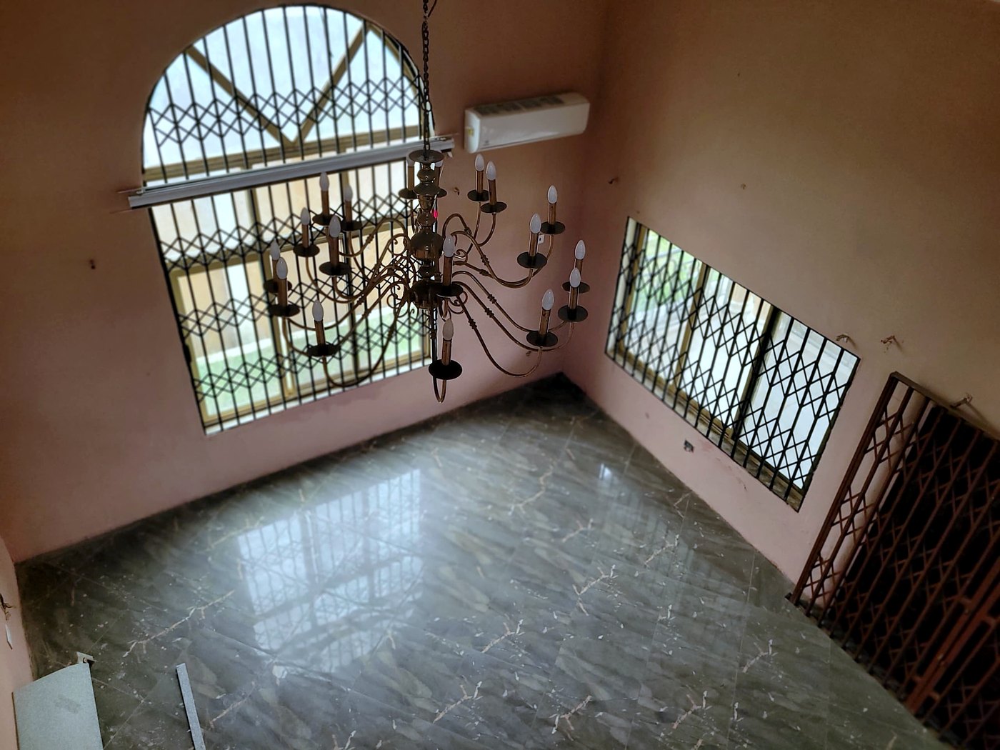 Reception with arched window and marble floor