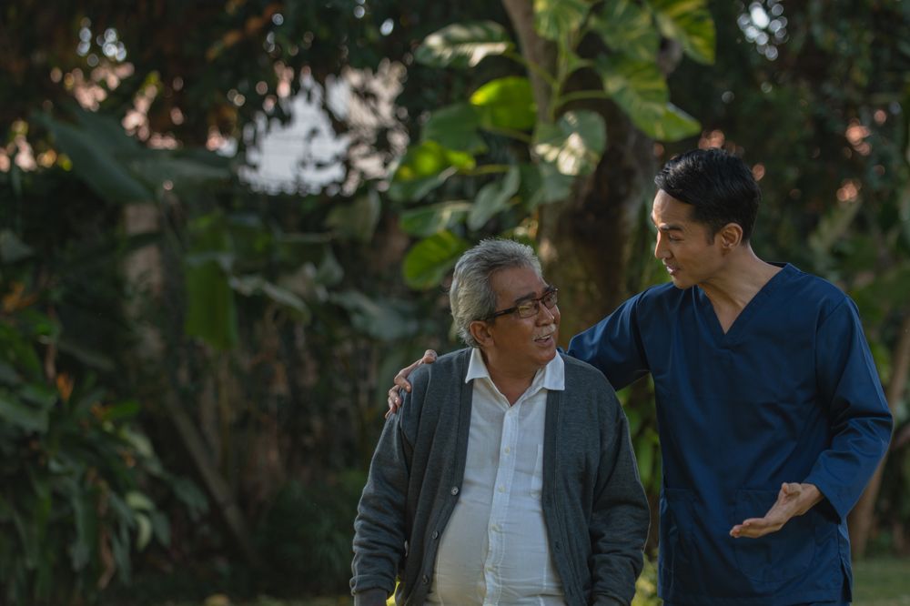 A caregiver helping a client at home with daily routines
