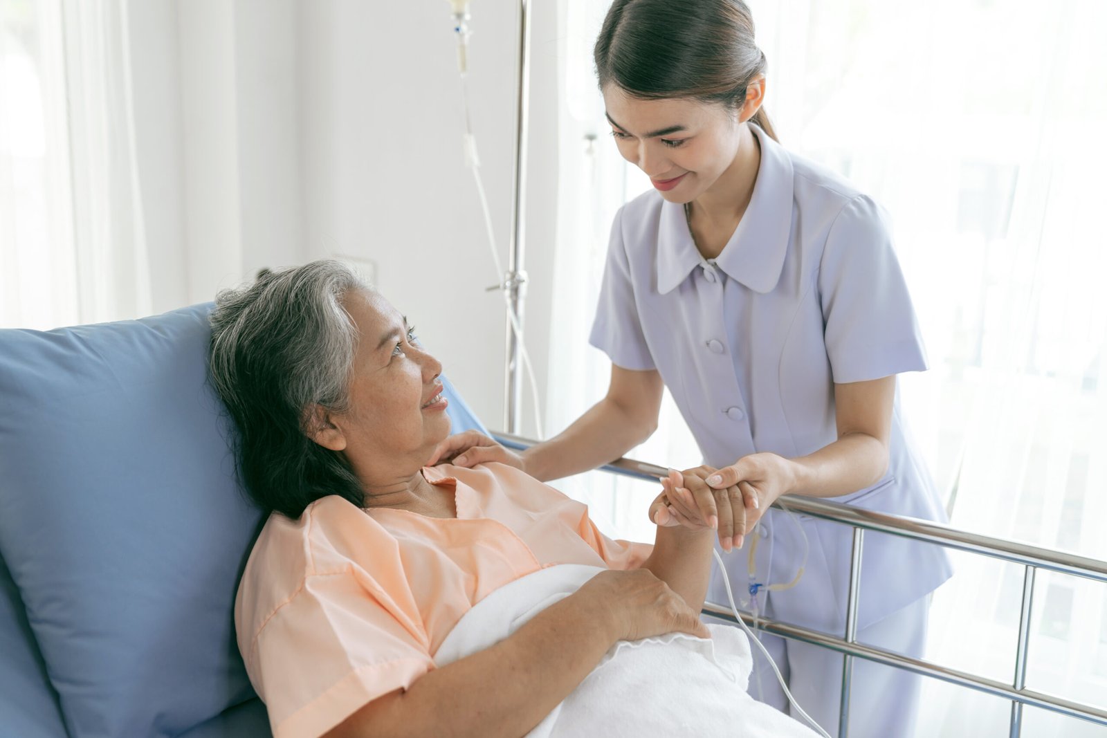 doctors-hold-hands-encourage-elderly-senior-woman-patients-hospital-senior-female-medical-healthcare-concept