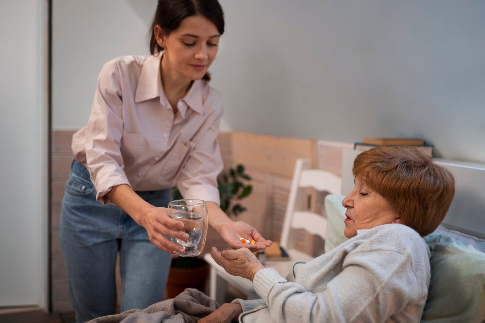 female-nurse-taking-care-elderly-person